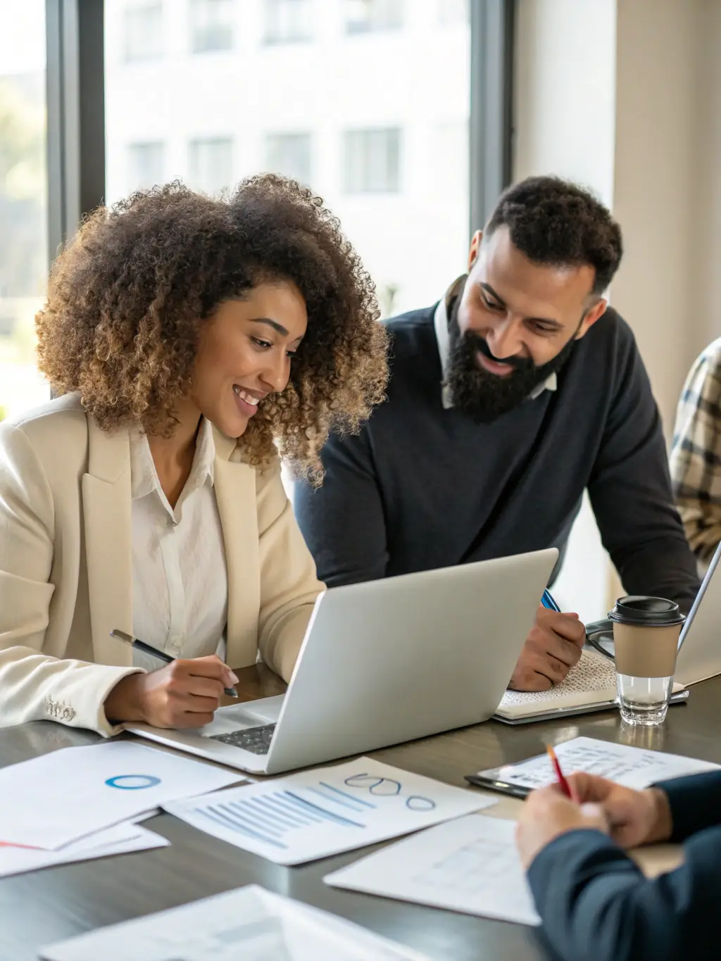 A diverse team of accounting professionals collaborating on financial strategies and solutions in a collaborative workspace, showcasing expertise and teamwork.